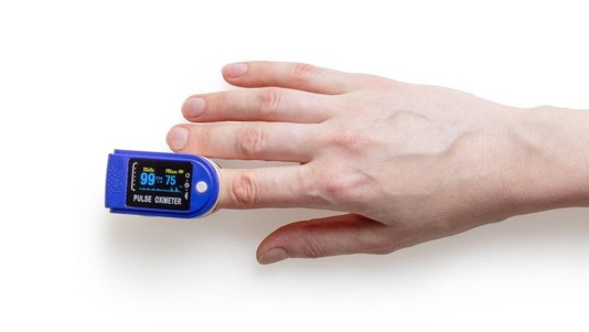 Close-up of a finger with oximeter